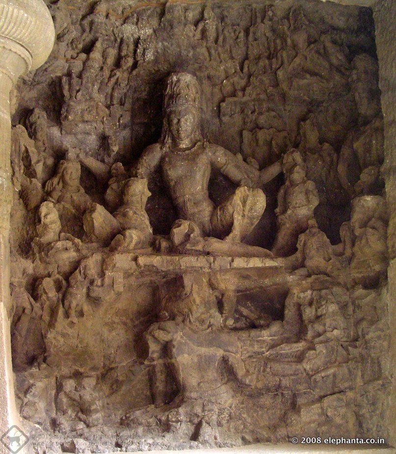 Ravana , the demon king of Lanka tries to lift Kailasa, the abode of Shiva. Seated beside Shiva is Parvati, his consort. 