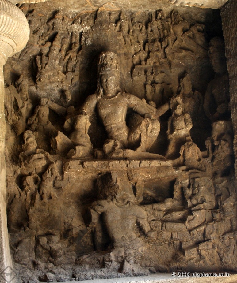 Ravana , the demon king of Lanka tries to lift Kailasa, the abode of Shiva. Seated beside Shiva is Parvati, his consort.